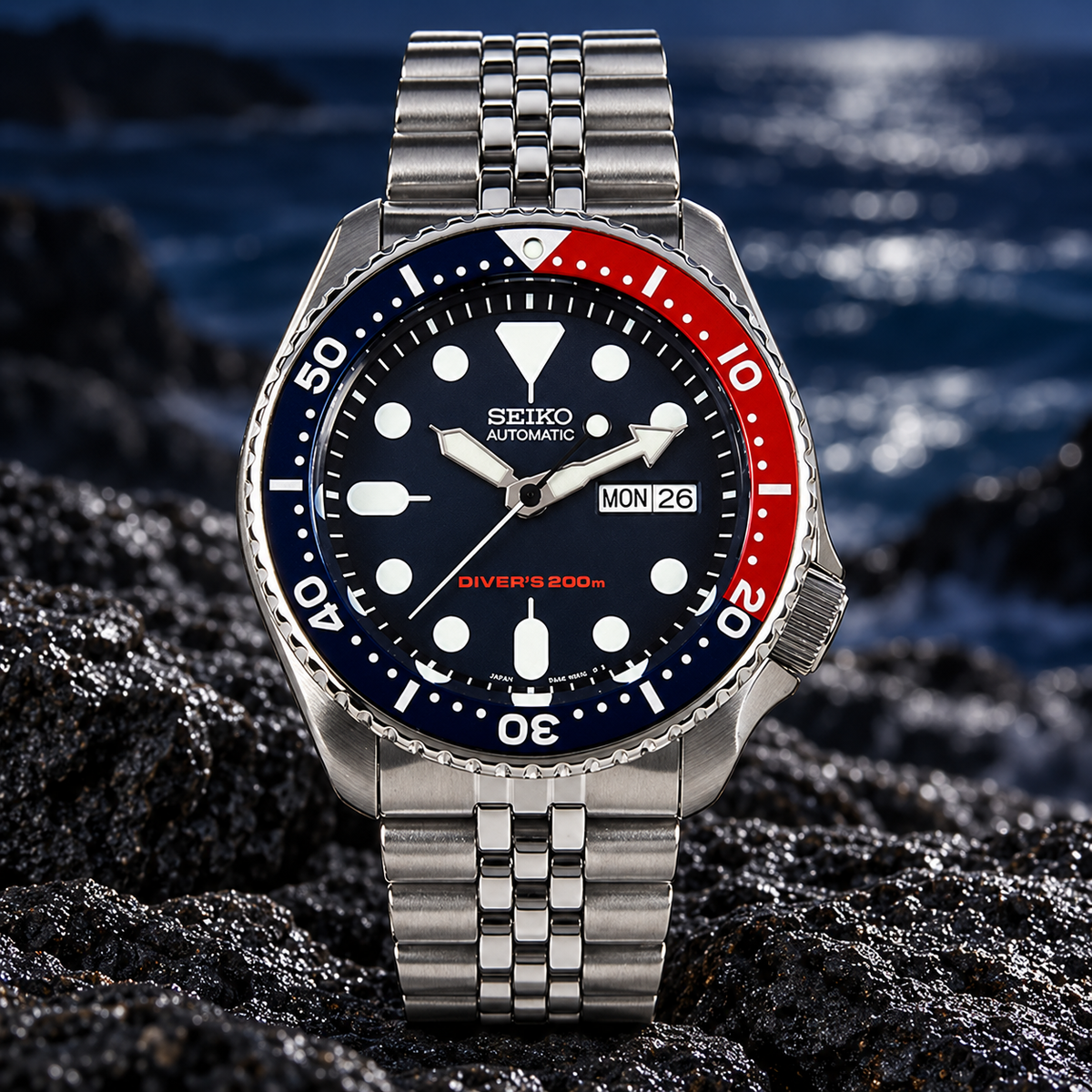 A collector’s classic: discontinued Seiko SKX009 “Pepsi,” offered as unworn New Old Stock with its original Jubilee bracelet, box and papers.