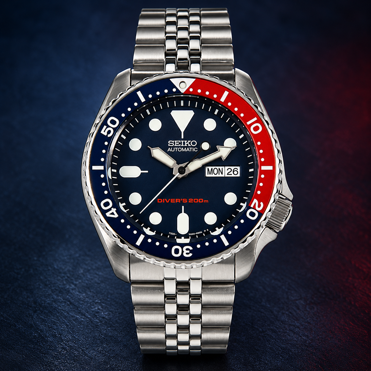 A collector’s classic: discontinued Seiko SKX009 “Pepsi,” offered as unworn New Old Stock with its original Jubilee bracelet, box and papers. — view 2