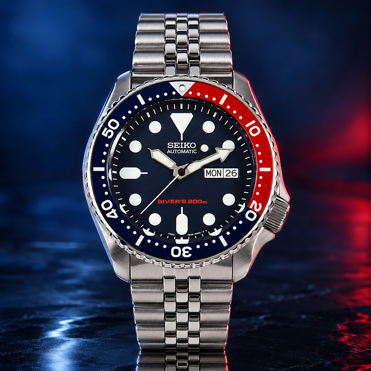 A collector’s classic: discontinued Seiko SKX009 “Pepsi,” offered as unworn New Old Stock with its original Jubilee bracelet, box and papers. — view 3