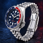 A collector’s classic: discontinued Seiko SKX009 “Pepsi,” offered as unworn New Old Stock with its original Jubilee bracelet, box and papers. view 5