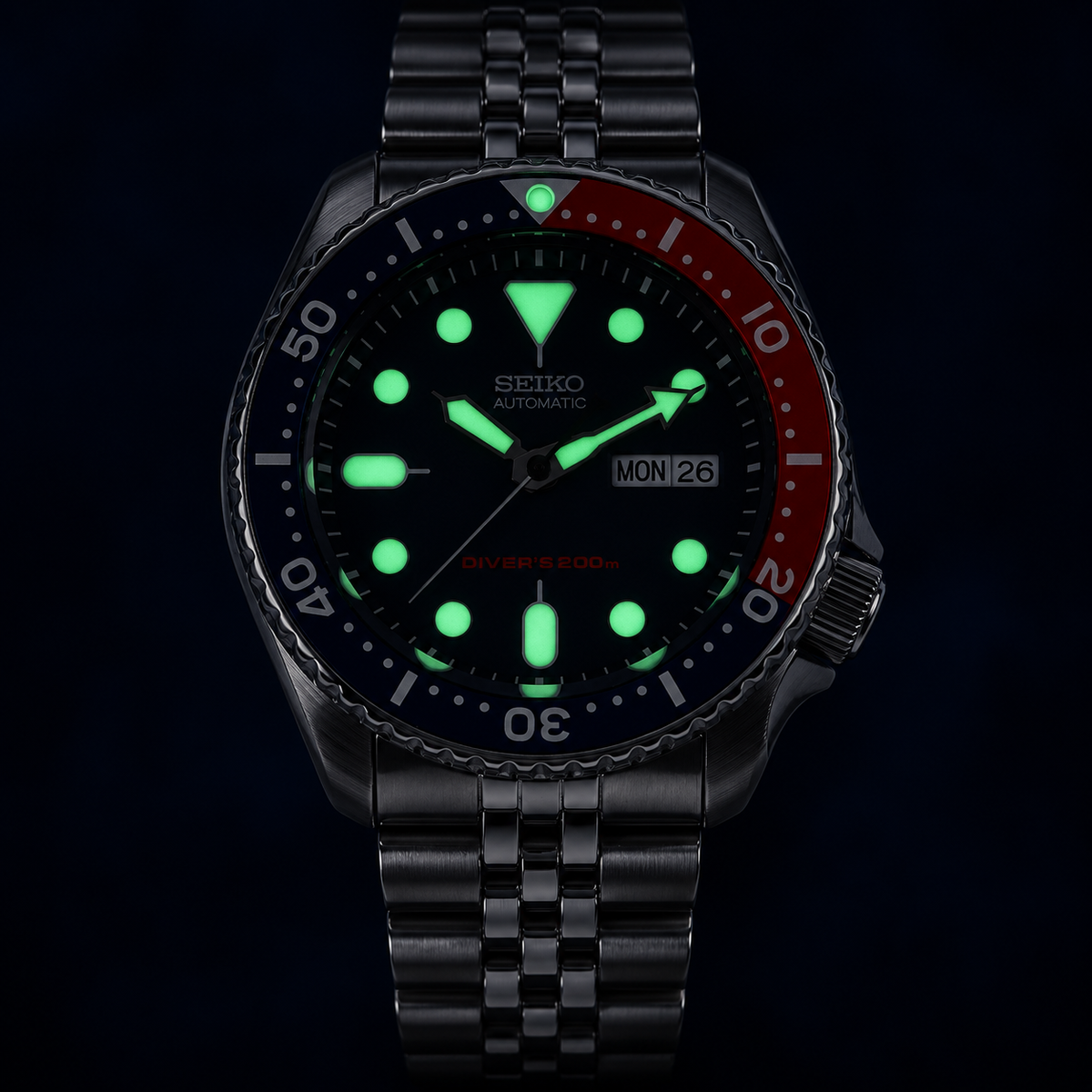 A collector’s classic: discontinued Seiko SKX009 “Pepsi,” offered as unworn New Old Stock with its original Jubilee bracelet, box and papers. — view 6