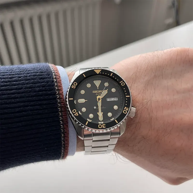 Seiko 5 Sports SRPD57K1 – Black Dial with Gold Accents — view 3